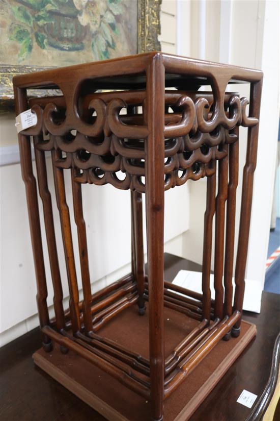 A quartetto of Chinese hardwood occasional tables, the square tops with pierced scrolled friezes